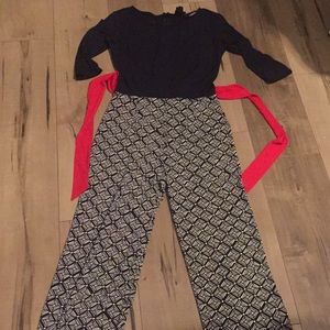 Navy blue jumpsuit with red detail